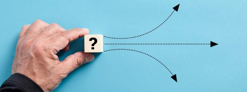 Male,Hand,Puts,A,Wooden,Cube,With,Question,Mark.,Different